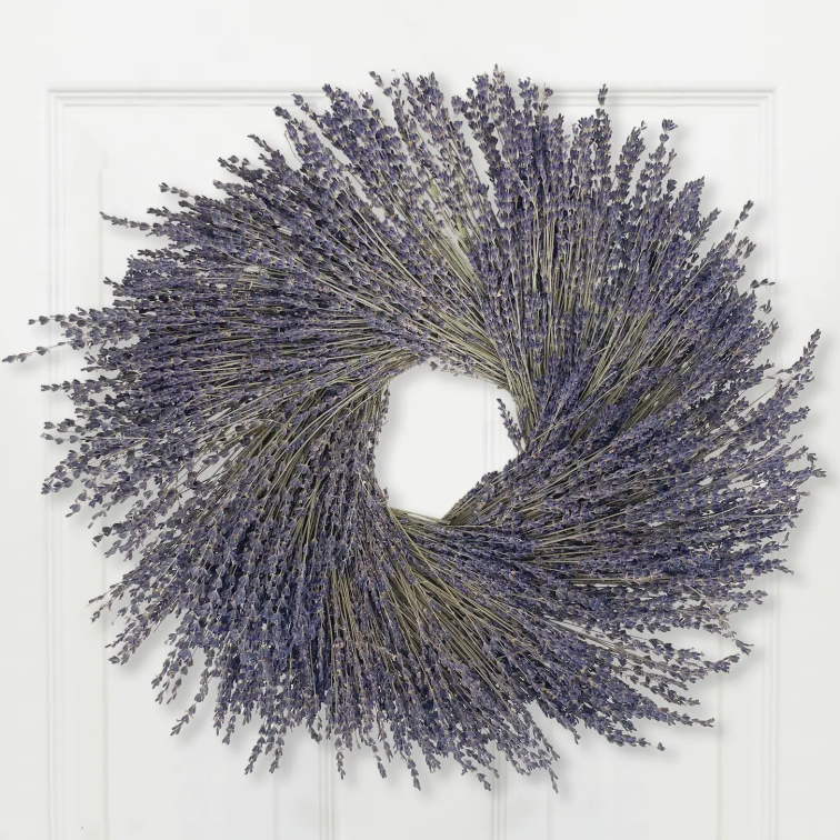 Decorative wreath made of lavender flowers on a white background